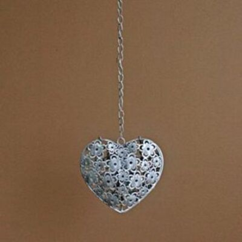 Metal heart candle box made from cut out little flower design. Has a chain so that it can be hung and hinge opening for you to place your T-light inside. Size 46x15x6cm